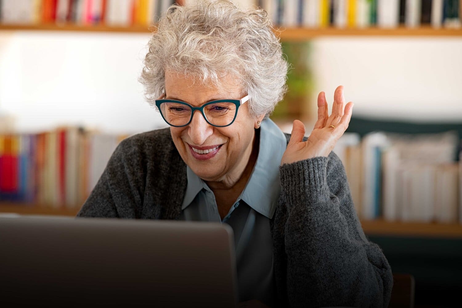 elderly woman using Virtual Senior Center Desktop Apps for Older Adults