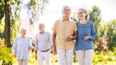 Group of seniors people bonding at the park The Hidden Benefits of Independent Living Communities for Seniors